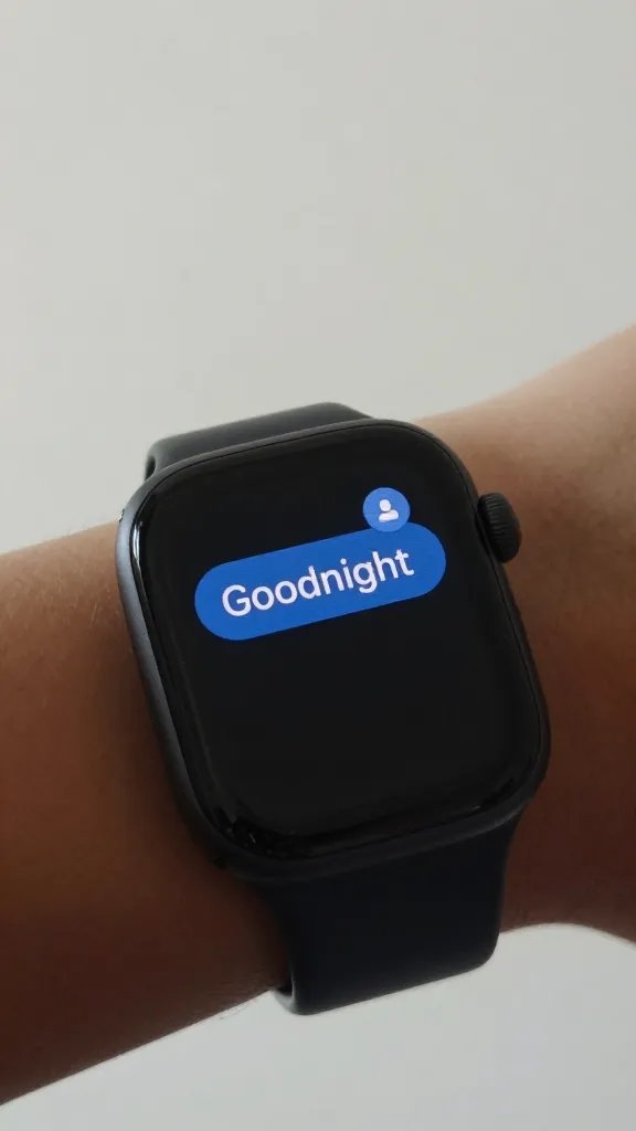 Focused shot of a smartwatch displaying a shared “Goodnight” message