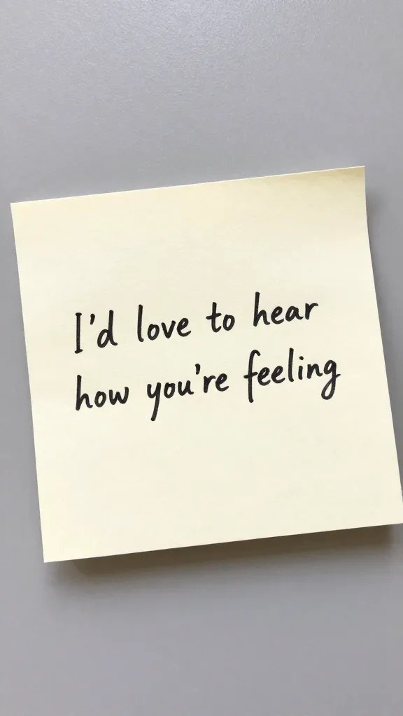 closeup of a note card with the line “I’d love to hear how you’re feeling” on a calm desk