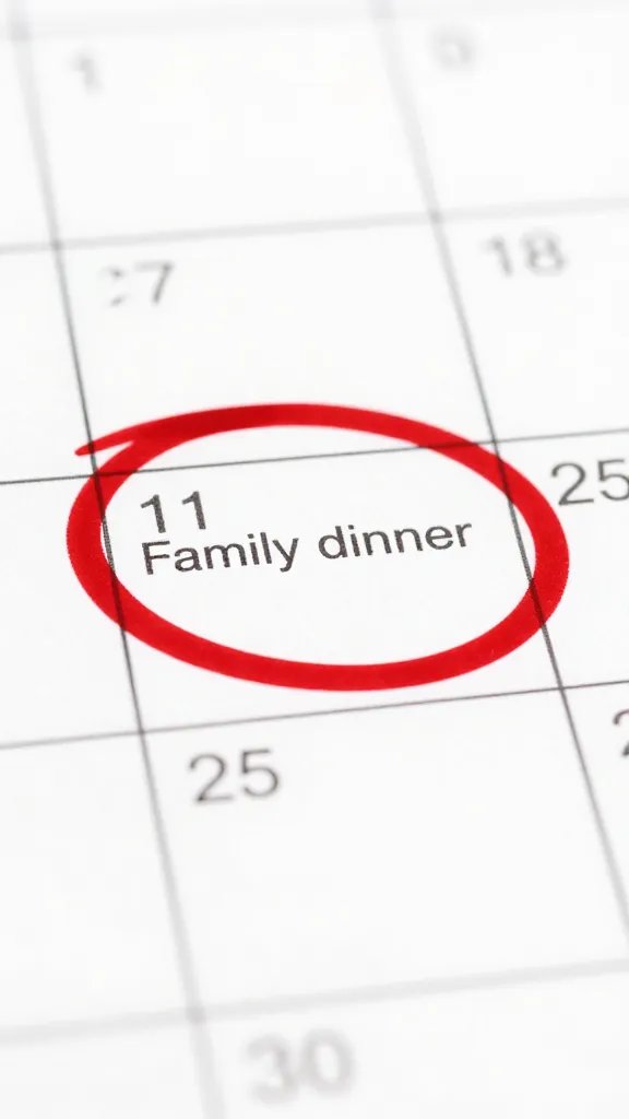 closeup of a calendar page with a single red-circled family dinner date