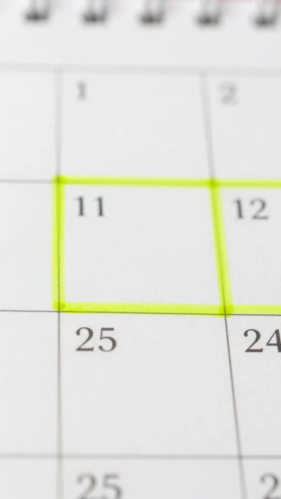Closeup of a calendar with highlighted boundaries and time blocks in marker