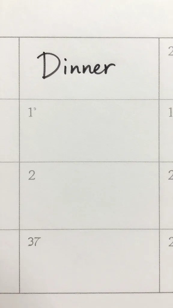 Closeup of a lone calendar page with a handwritten dinner plan