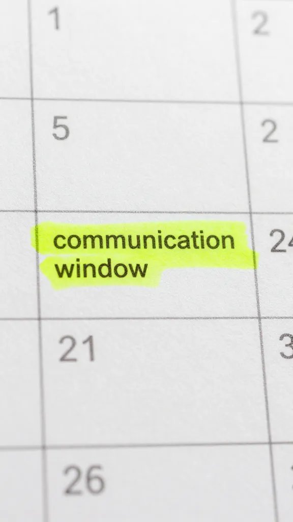 Closeup of a calendar page with a single highlighted “communication window” day
