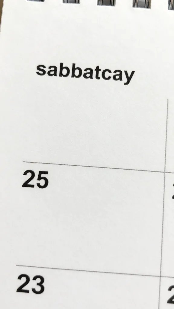 Close-up of a calendar page marked with sabbatical planning, single couple’s initials