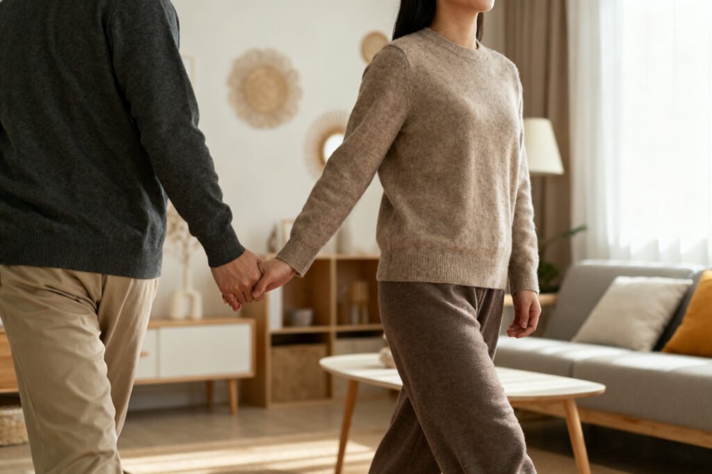 A couple walking and holding hands