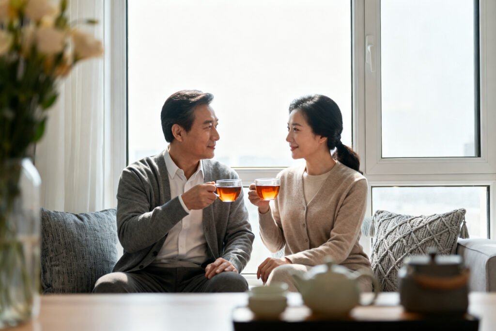 A couple sharing tea by a window