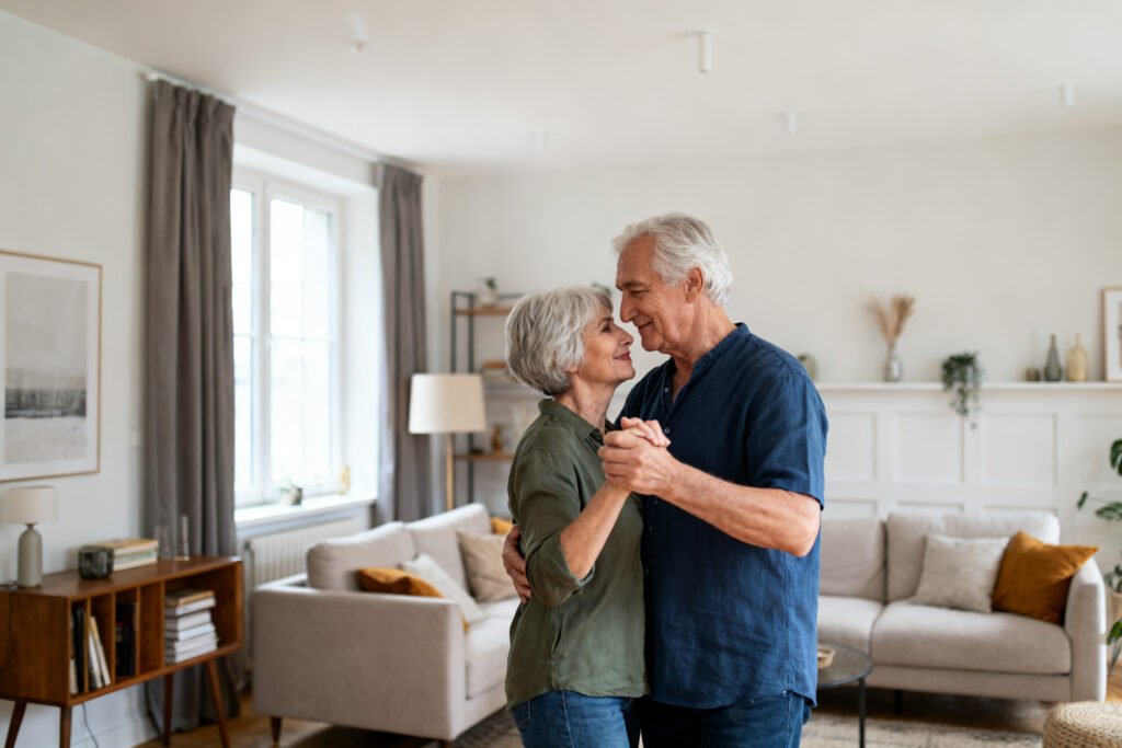 A couple slow dancing at home