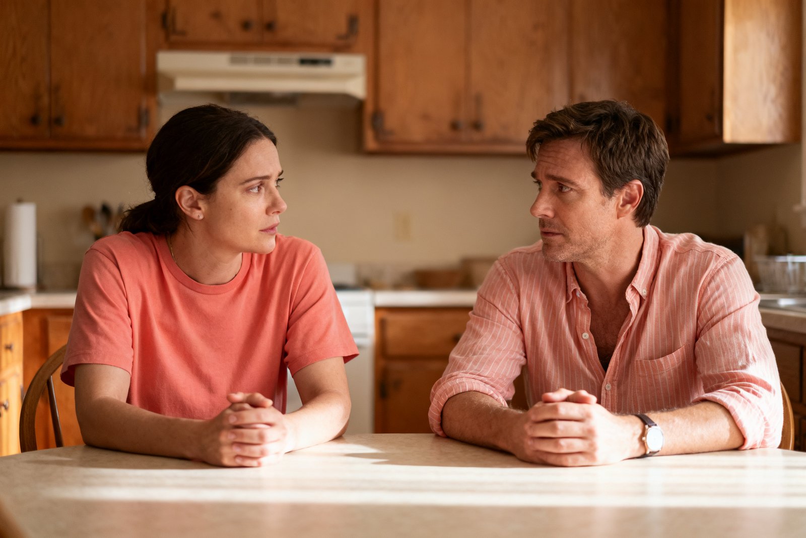 A couple pausing to reflect at the kitchen table