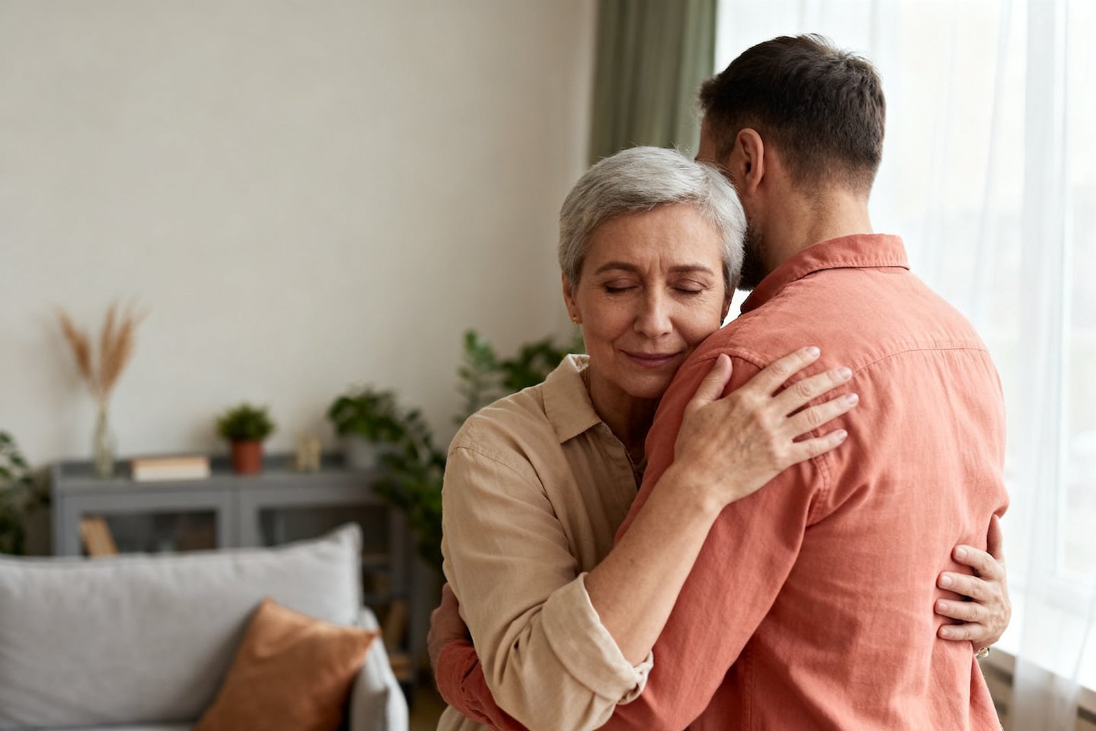 A couple reconnecting with a gentle, understanding hug