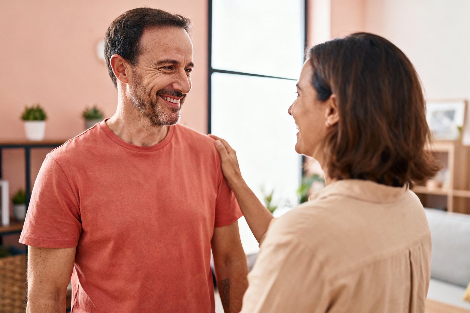 A couple reconnecting with appreciative smiles