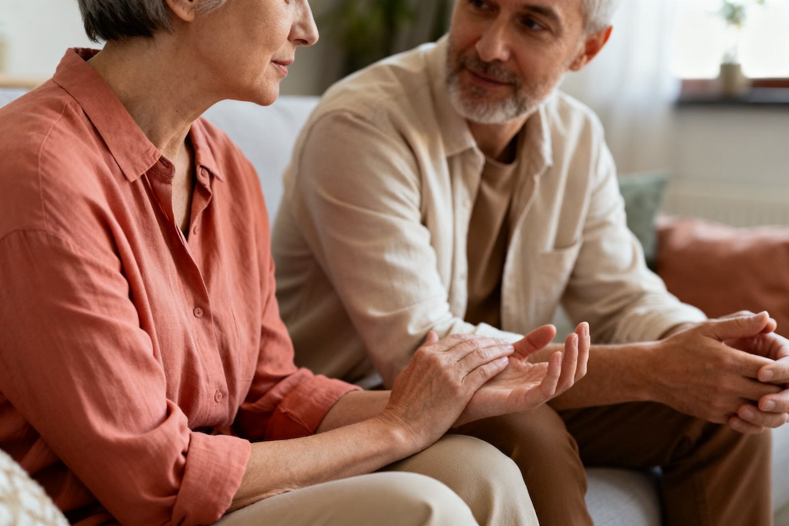 Two people talking softly with compassion