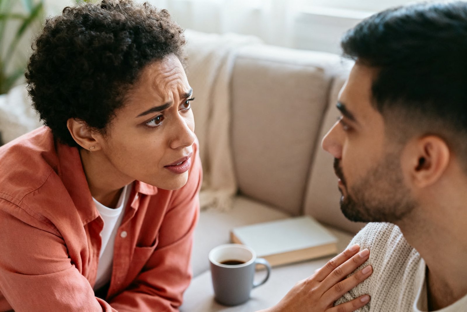 A couple in gentle, caring conversation, one asking how the other is really doing