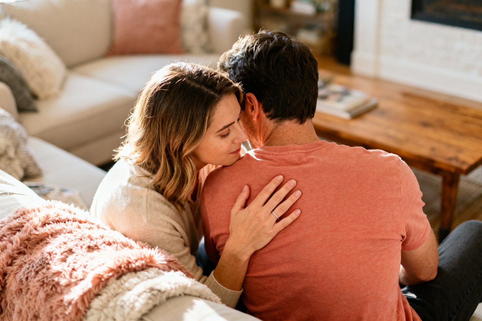 A couple sharing a tender, reassuring moment, one offering comfort and warmth to the other